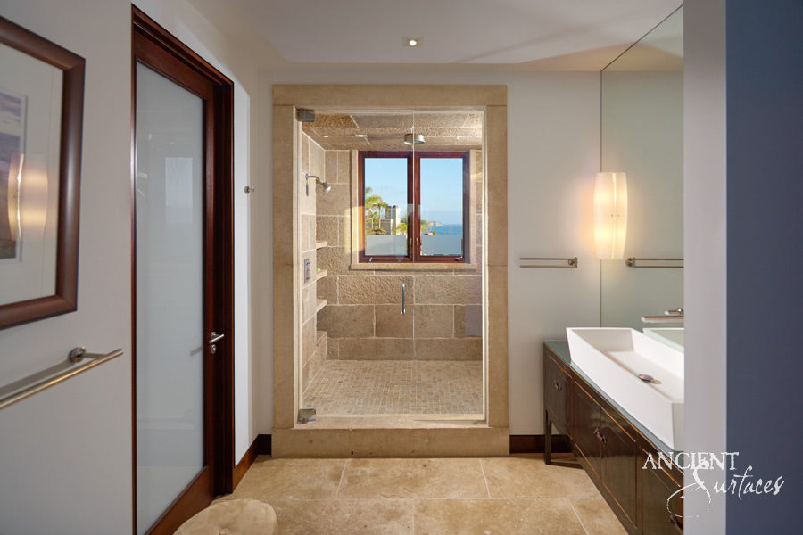 reclaimed_antique_stone_tub_marble_limestone_freestanding_bathtub_hand_carved_soaking_tub_luxury_bath_ancient_surfaces_historic_stonebath_sculpted_stone_tub_custom_carved_marble_bathtub_reclaimed_limestone_tub_old_world_bath_design_classic_european_stone_tub_high_end_bathroom_feature_luxury_interior_design_artisanal_stonework_antique_marble_tub_natural_stone_bath_vintage_stone_bathtub_master_bath_suite_ancient_surfaces_collection