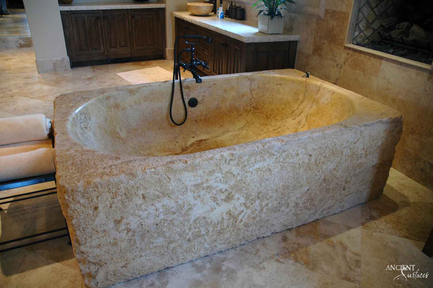 reclaimed_antique_stone_tub_marble_limestone_freestanding_bathtub_hand_carved_soaking_tub_luxury_bath_ancient_surfaces_historic_stonebath_sculpted_stone_tub_custom_carved_marble_bathtub_reclaimed_limestone_tub_old_world_bath_design_classic_european_stone_tub_high_end_bathroom_feature_luxury_interior_design_artisanal_stonework_antique_marble_tub_natural_stone_bath_vintage_stone_bathtub_master_bath_suite_ancient_surfaces_collection