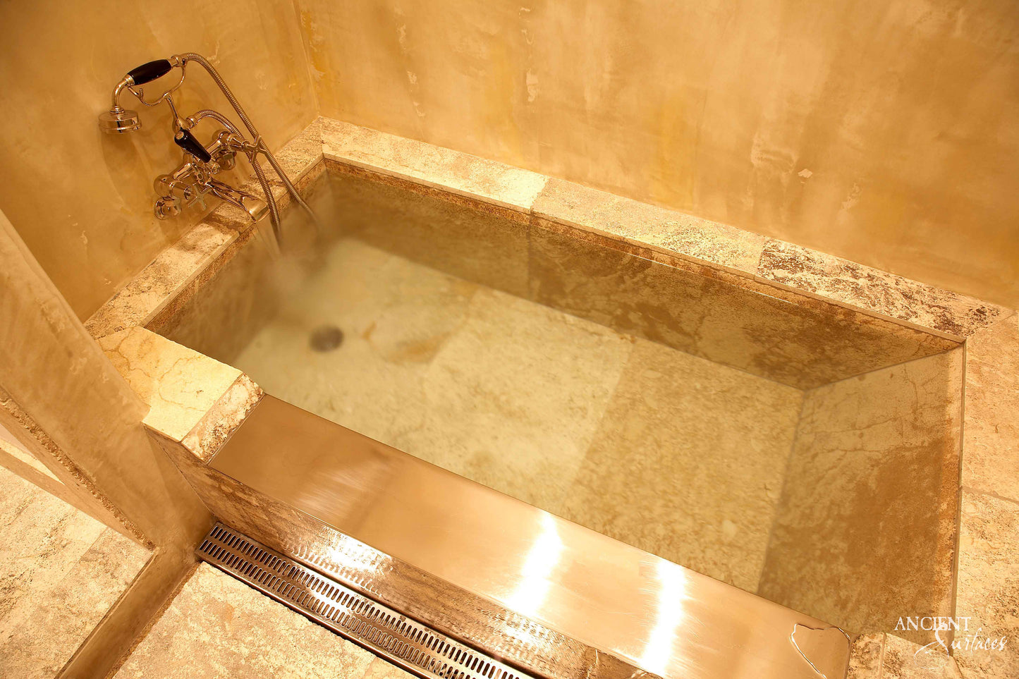 reclaimed_antique_stone_tub_marble_limestone_freestanding_bathtub_hand_carved_soaking_tub_luxury_bath_ancient_surfaces_historic_stonebath_sculpted_stone_tub_custom_carved_marble_bathtub_reclaimed_limestone_tub_old_world_bath_design_classic_european_stone_tub_high_end_bathroom_feature_luxury_interior_design_artisanal_stonework_antique_marble_tub_natural_stone_bath_vintage_stone_bathtub_master_bath_suite_ancient_surfaces_collection