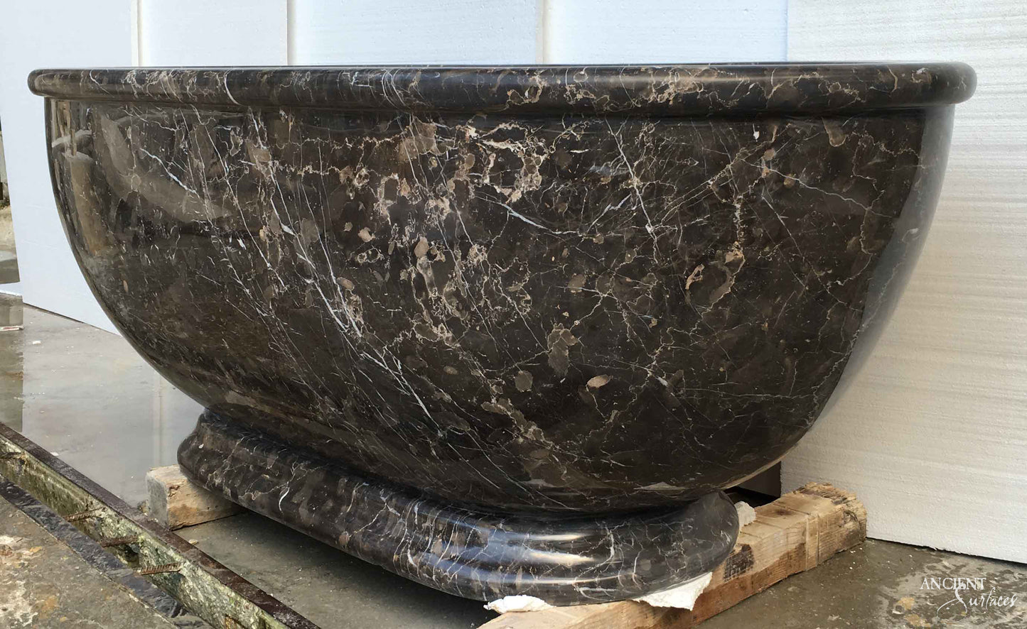 reclaimed_antique_stone_tub_marble_limestone_freestanding_bathtub_hand_carved_soaking_tub_luxury_bath_ancient_surfaces_historic_stonebath_sculpted_stone_tub_custom_carved_marble_bathtub_reclaimed_limestone_tub_old_world_bath_design_classic_european_stone_tub_high_end_bathroom_feature_luxury_interior_design_artisanal_stonework_antique_marble_tub_natural_stone_bath_vintage_stone_bathtub_master_bath_suite_ancient_surfaces_collection