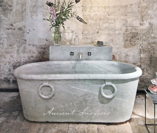 reclaimed_antique_stone_tub_marble_limestone_freestanding_bathtub_hand_carved_soaking_tub_luxury_bath_ancient_surfaces_historic_stonebath_sculpted_stone_tub_custom_carved_marble_bathtub_reclaimed_limestone_tub_old_world_bath_design_classic_european_stone_tub_high_end_bathroom_feature_luxury_interior_design_artisanal_stonework_antique_marble_tub_natural_stone_bath_vintage_stone_bathtub_master_bath_suite_ancient_surfaces_collection
