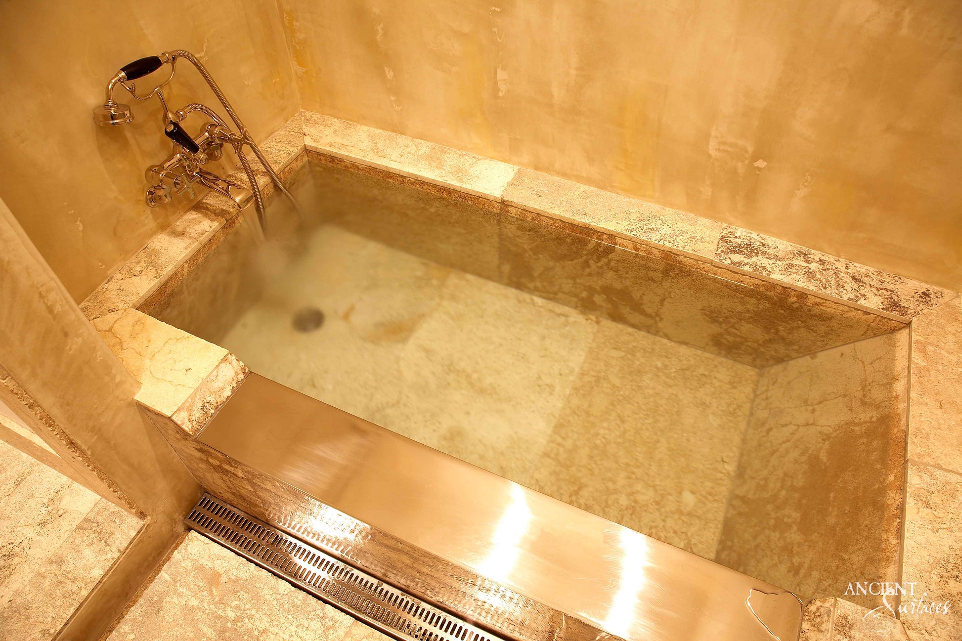 reclaimed_antique_stone_tub_marble_limestone_freestanding_bathtub_hand_carved_soaking_tub_luxury_bath_ancient_surfaces_historic_stonebath_sculpted_stone_tub_custom_carved_marble_bathtub_reclaimed_limestone_tub_old_world_bath_design_classic_european_stone_tub_high_end_bathroom_feature_luxury_interior_design_artisanal_stonework_antique_marble_tub_natural_stone_bath_vintage_stone_bathtub_master_bath_suite_ancient_surfaces_collection
