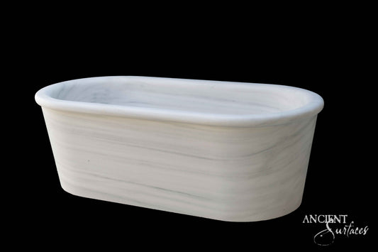 reclaimed_antique_stone_tub_marble_limestone_freestanding_bathtub_hand_carved_soaking_tub_luxury_bath_ancient_surfaces_historic_stonebath_sculpted_stone_tub_custom_carved_marble_bathtub_reclaimed_limestone_tub_old_world_bath_design_classic_european_stone_tub_high_end_bathroom_feature_luxury_interior_design_artisanal_stonework_antique_marble_tub_natural_stone_bath_vintage_stone_bathtub_master_bath_suite_ancient_surfaces_collection
