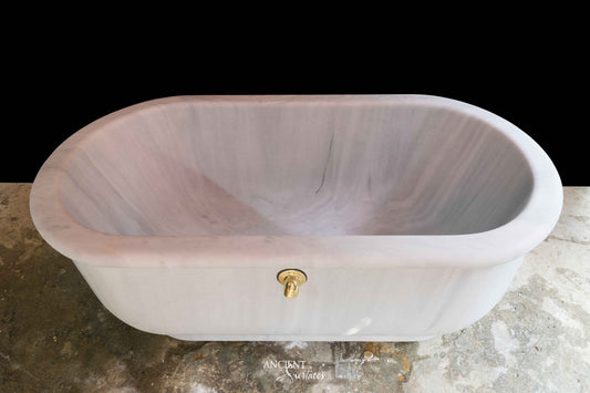 reclaimed_antique_stone_tub_marble_limestone_freestanding_bathtub_hand_carved_soaking_tub_luxury_bath_ancient_surfaces_historic_stonebath_sculpted_stone_tub_custom_carved_marble_bathtub_reclaimed_limestone_tub_old_world_bath_design_classic_european_stone_tub_high_end_bathroom_feature_luxury_interior_design_artisanal_stonework_antique_marble_tub_natural_stone_bath_vintage_stone_bathtub_master_bath_suite_ancient_surfaces_collection
